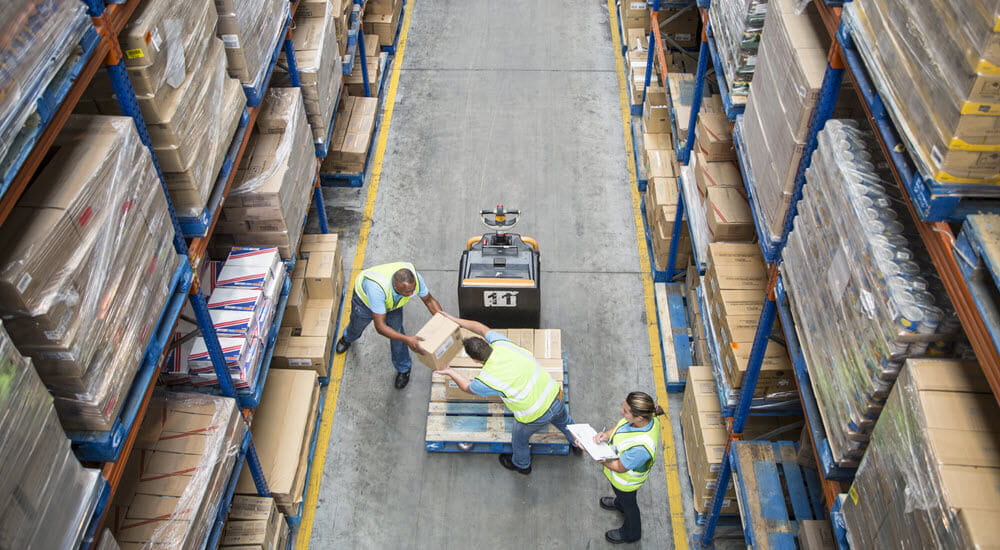 Workers inside a food distribution warehouse